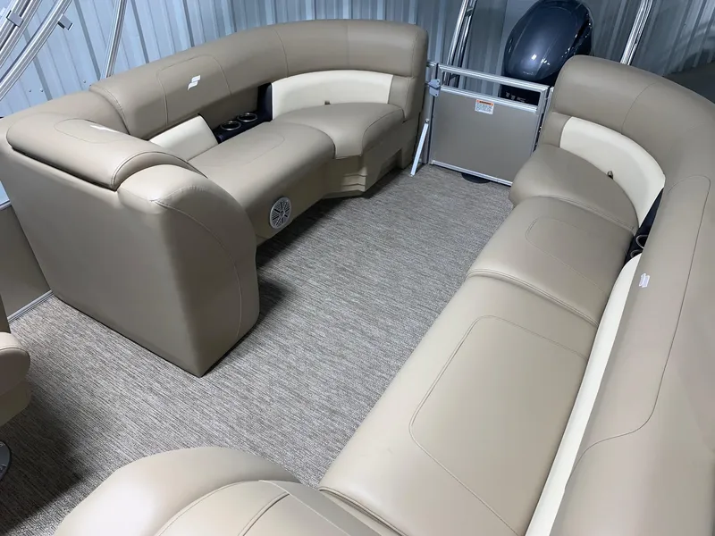 Slide: The Image of 2024 Starcraft LX22 R pontoon boat interior with beige seating. - 8