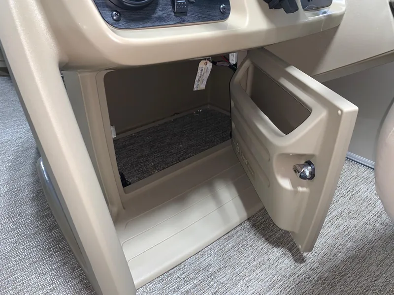 Slide: The Image of 2024 Starcraft LX22 R storage compartment with open door. - 9