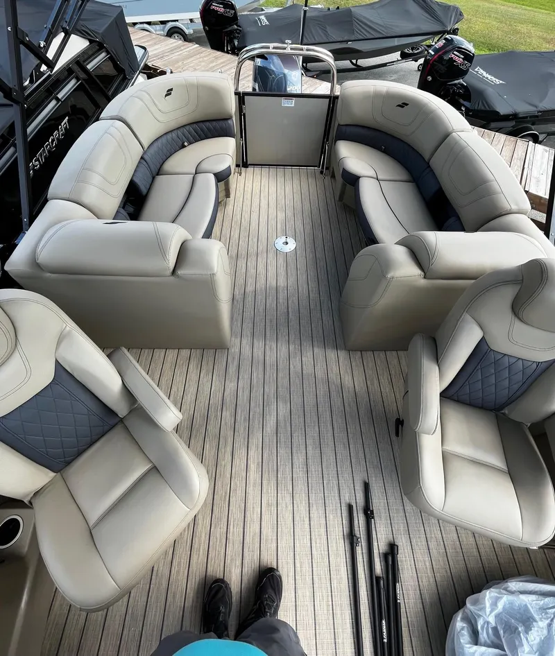 Slide: The Image of 2024 Starcraft SLS 3 pontoon boat with spacious seating and modern design. - 10