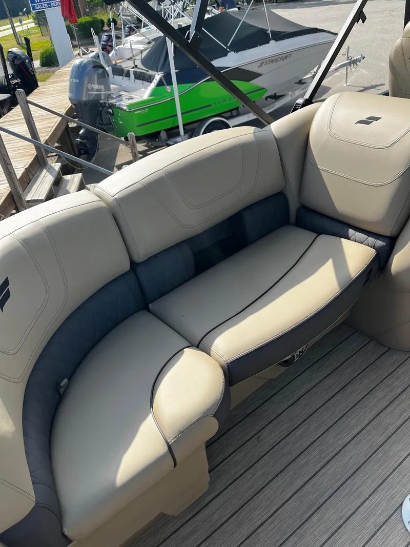 Slide: The Image of 2024 Starcraft SLS 3 boat with beige and gray seating. - 14