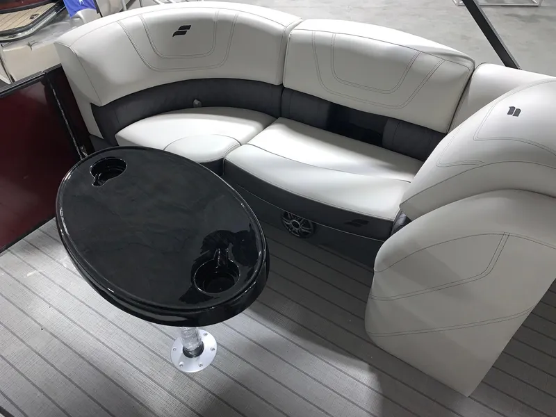 Slide: The Image of 2024 Starcraft SLS 3 boat interior with white seating and black table. - 5
