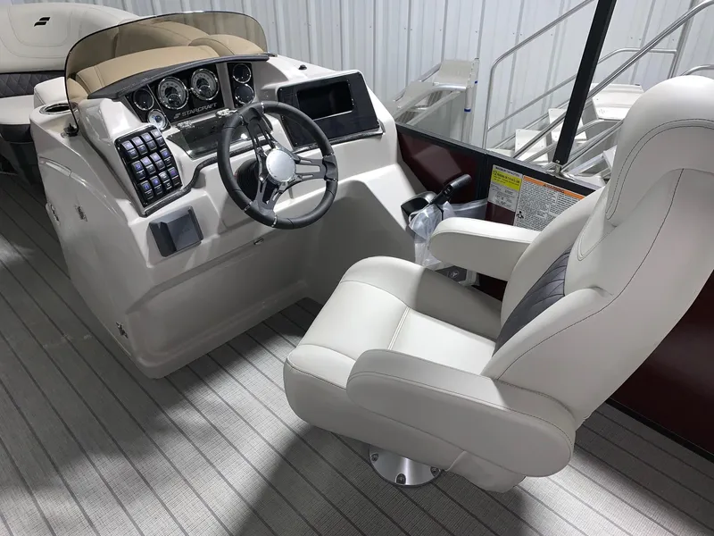 Slide: The Image of 2024 Starcraft SLS 3 boat helm with captain's chair and modern dashboard. - 6