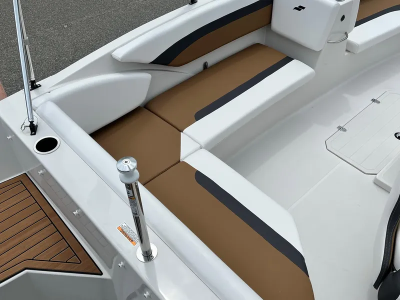 Slide: The Image of 2024 Starcraft SVX 171 boat interior with brown and white seating. - 10