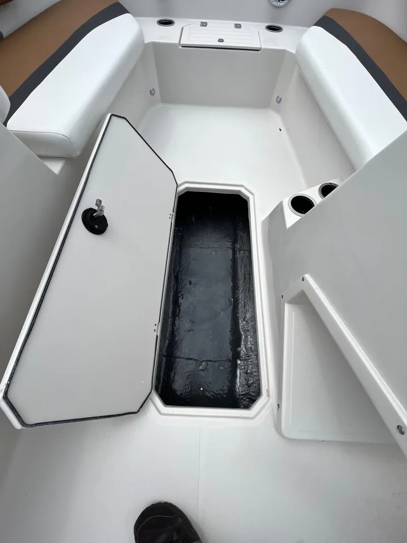 Slide: The Image of 2024 Starcraft SVX 171 boat interior with open storage compartment. - 8