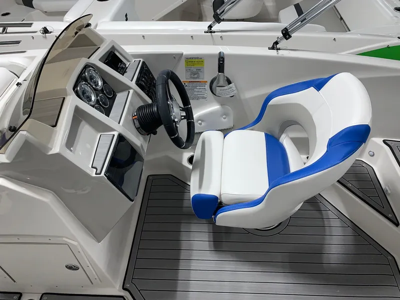 Slide: The Image of 2024 Starcraft SVX 191 boat cockpit with blue and white captain's chair. - 3