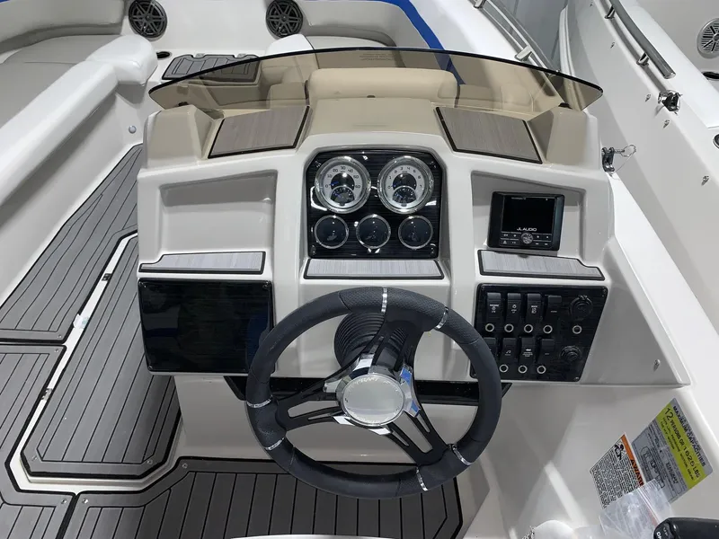 Slide: The Image of 2024 Starcraft SVX 191 boat dashboard with steering wheel and control panel. - 4