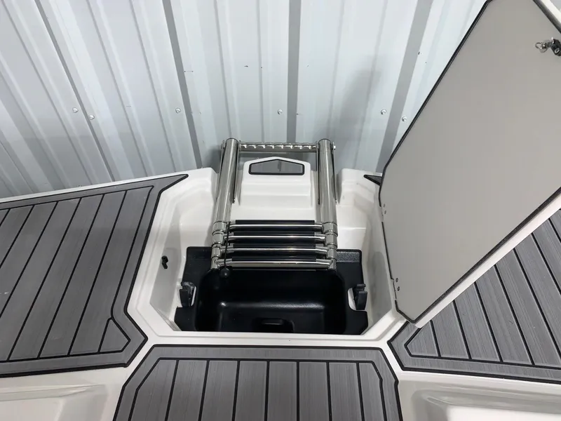 Slide: The Image of 2024 Starcraft SVX 191 boat with foldable ladder and storage compartment. - 7