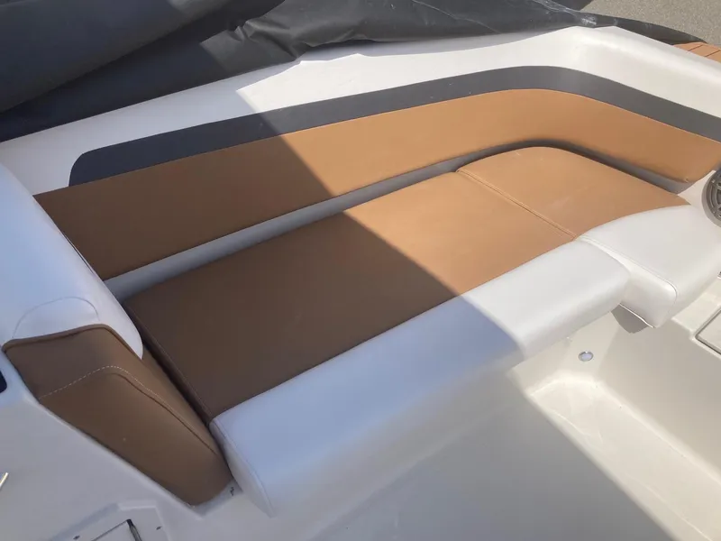 Slide: The Image of 2024 Starcraft SVX 191 boat interior with brown and white seating. - 10