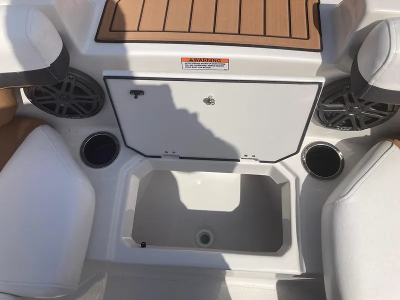 Slide: The Image of 2024 Starcraft SVX 191 boat interior storage compartment and seating area. - 11