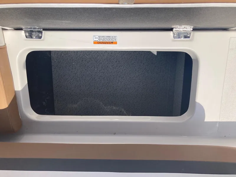 Slide: The Image of 2024 Starcraft SVX 191 storage compartment with open hatch. - 13