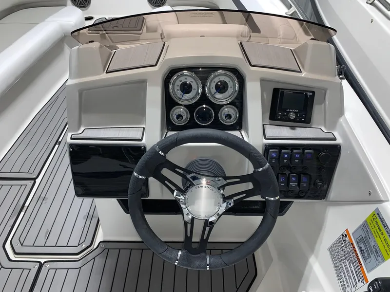 Slide: The Image of 2024 Starcraft SVX 191 boat dashboard with steering wheel and control panel. - 3