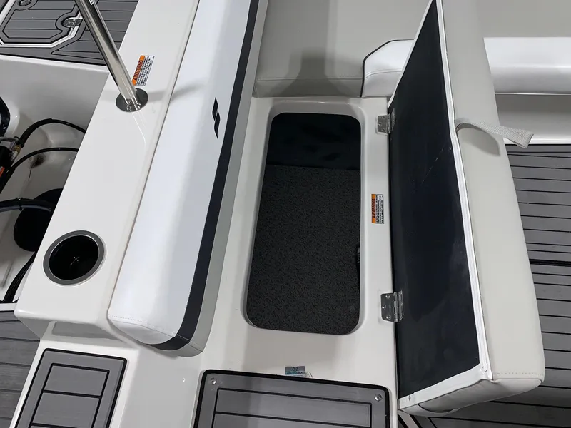 Slide: The Image of 2024 Starcraft SVX 191 boat storage compartment with open lid. - 4