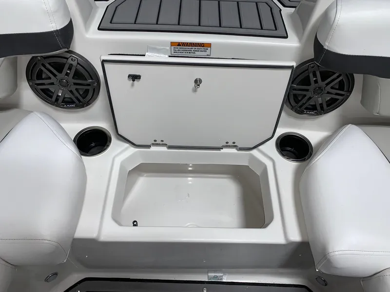 Slide: The Image of 2024 Starcraft SVX 191 boat interior with storage compartment and cup holders. - 6
