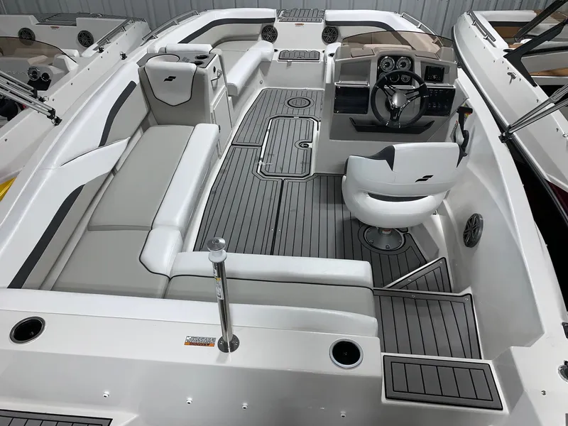 Slide: The Image of 2024 Starcraft SVX 191 boat interior with white and gray seating and modern dashboard. - 8