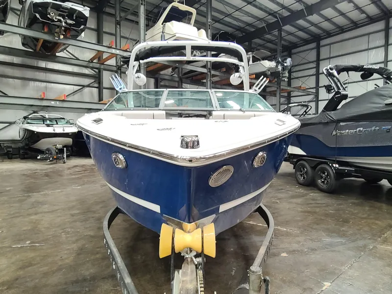 Slide: The Image of 2023 Four Winns H2 boat in storage facility, front view. - 1