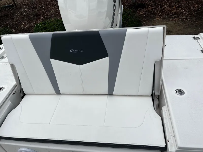 Slide: The Image of 2024 Robalo 266 Cayman boat seat with white and gray upholstery. - 11