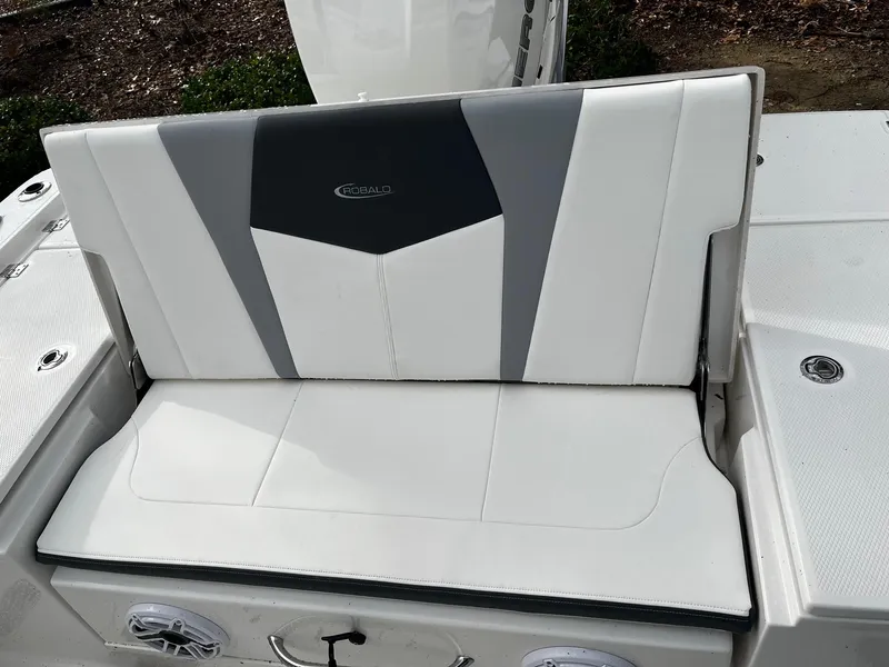 Slide: The Image of 2024 Robalo 266 Cayman boat seat with white and gray upholstery. - 12