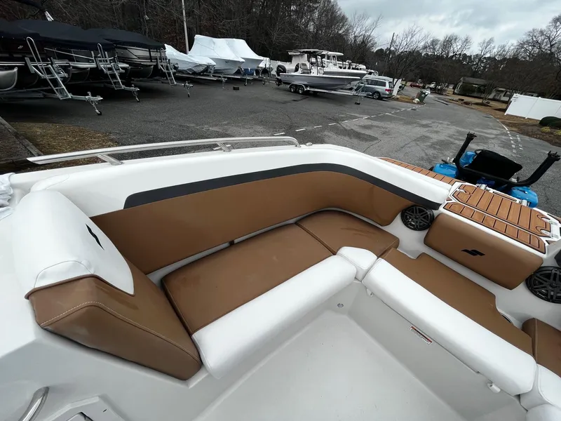 Slide: The Image of 2024 Starcraft SVX 231 boat interior with tan and white seating. - 17