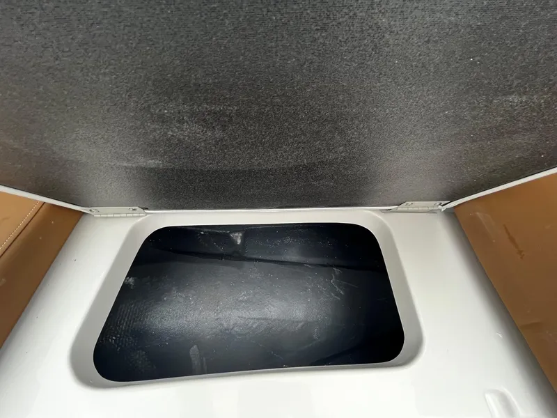 Slide: The Image of 2024 Starcraft SVX 231 storage compartment with black interior. - 19