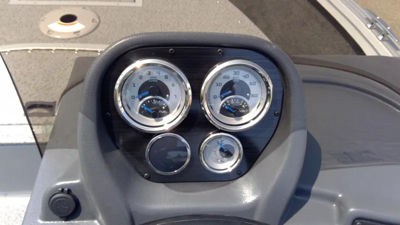 Slide: The Image of Dashboard of 2023 Starcraft Stealth 166 SC boat with gauges and controls. - 13