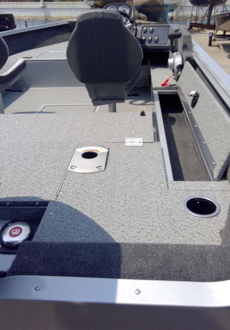 Slide: The Image of 2023 Starcraft Stealth 166 SC fishing boat interior with seating and control panel. - 8