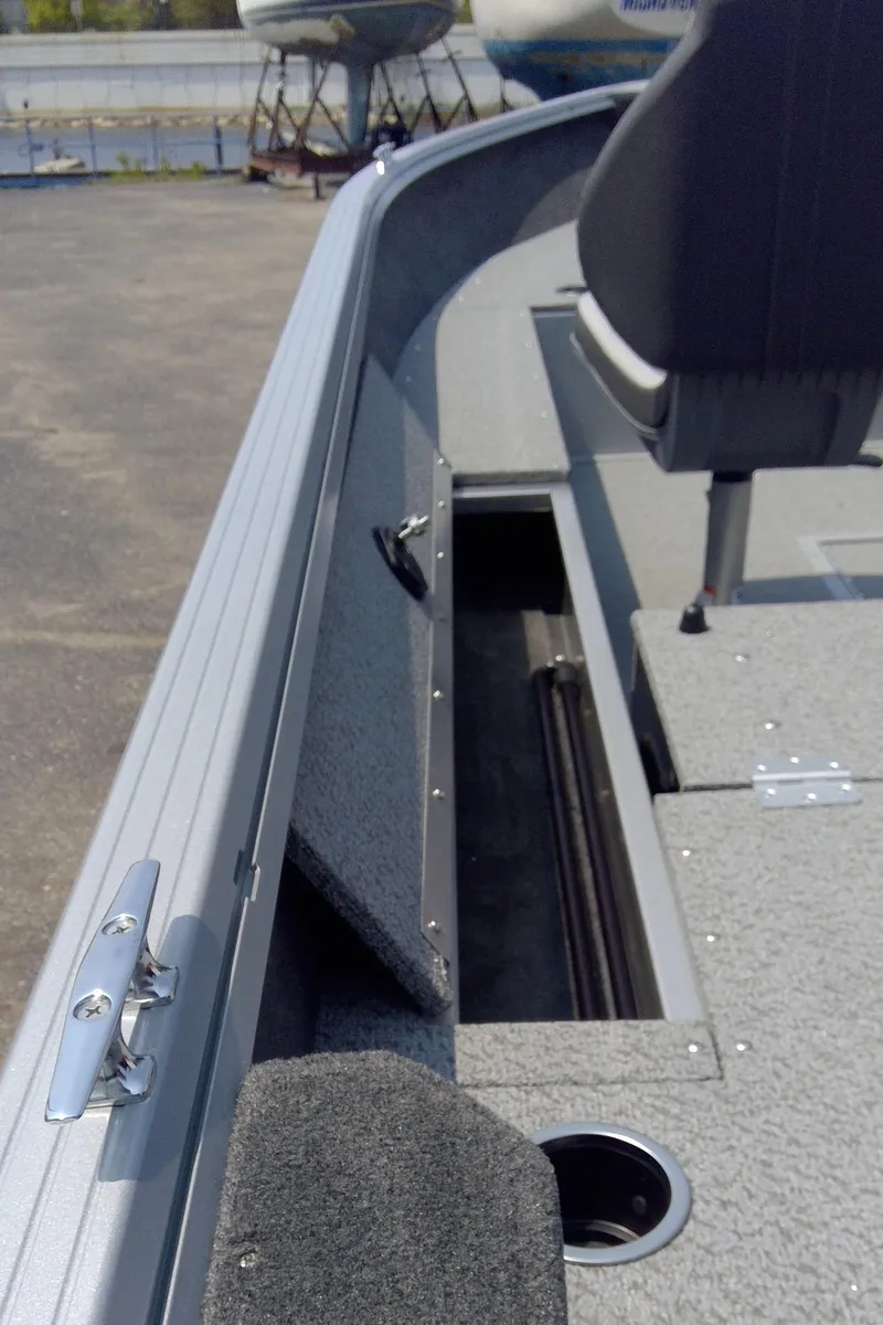 Slide: The Image of 2023 Starcraft Stealth 166 SC boat interior with storage compartment. - 9