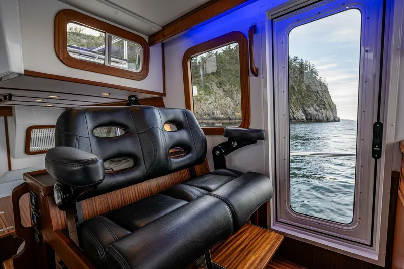 Slide: The Image of Interior of 2024 Nordic Tug 40 with ocean view through windows. - 22