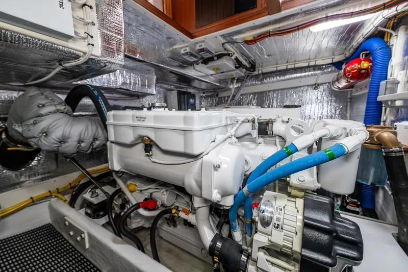 Slide: The Image of Engine room of 2024 Nordic Tug 40, showcasing modern marine engine and components. - 37