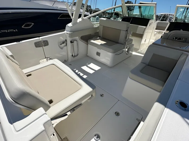 Slide: The Image of 2024 Boston Whaler 280 Vantage boat interior with seating and storage compartments. - 4