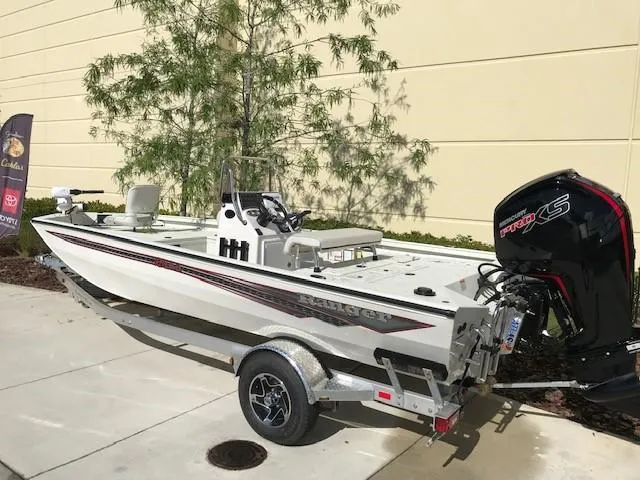 Slide: The Image of 2023 Ranger RB190 boat with Mercury Pro XS engine on a trailer. - 2