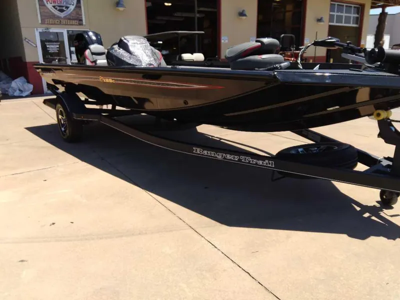 Slide: The Image of 2023 Ranger RT188C fishing boat on trailer outside dealership. - 0