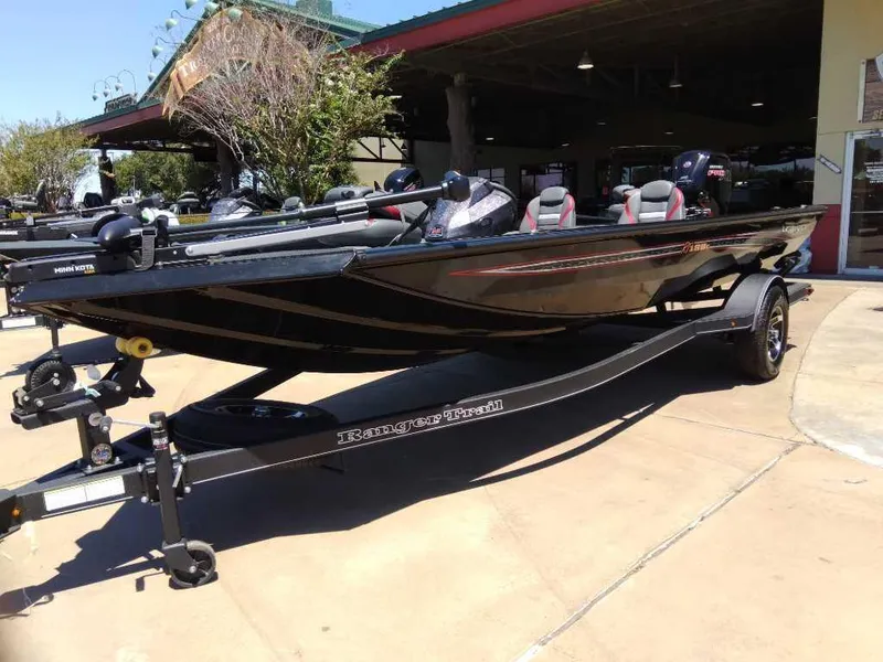 Slide: The Image of 2023 Ranger RT188C fishing boat on trailer, parked outdoors. - 1