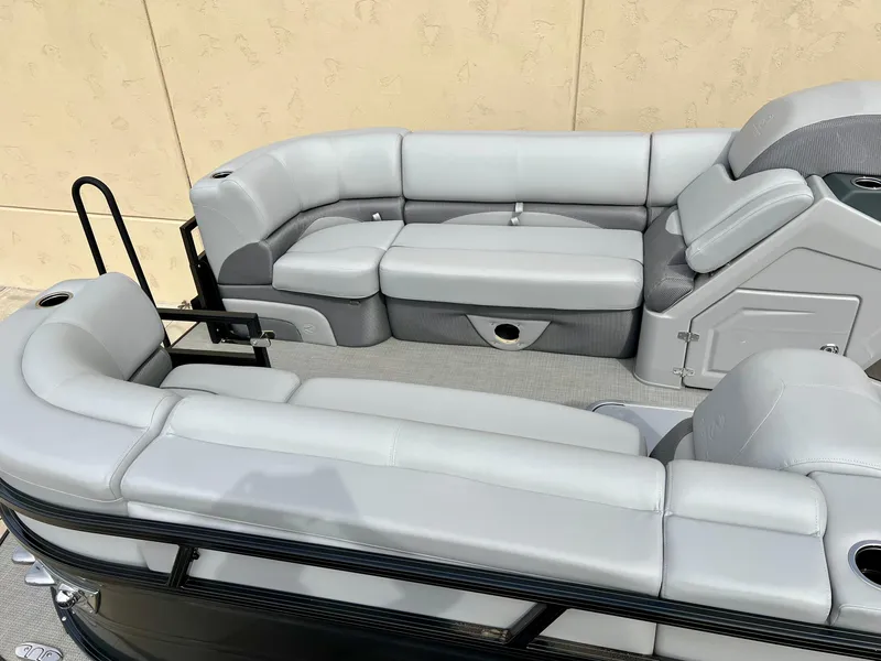 Slide: The Image of 2023 Regency 230 DL3 pontoon boat with spacious seating and modern design. - 1
