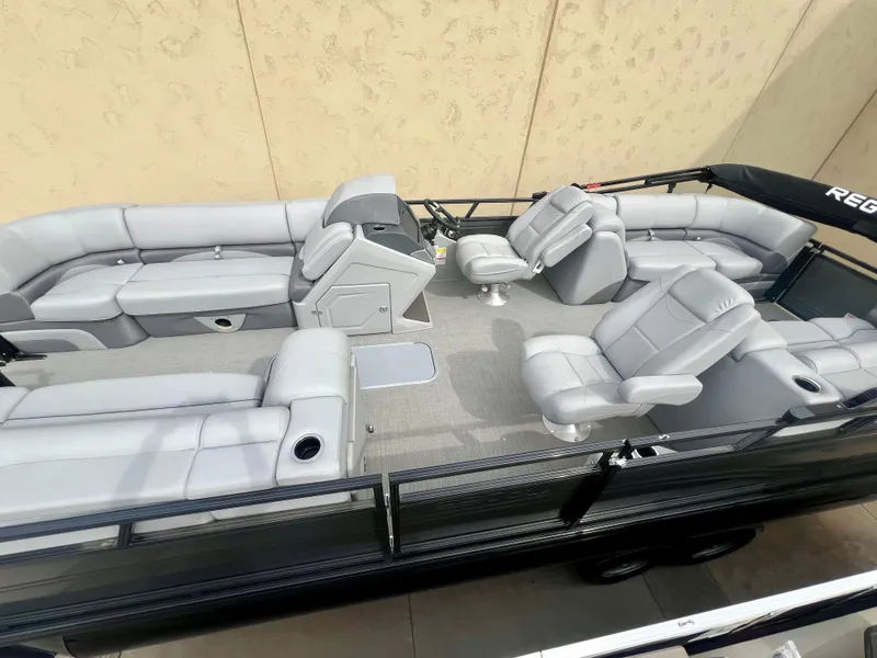 Slide: The Image of 2023 Regency 230 DL3 pontoon boat with spacious seating and modern design. - 3