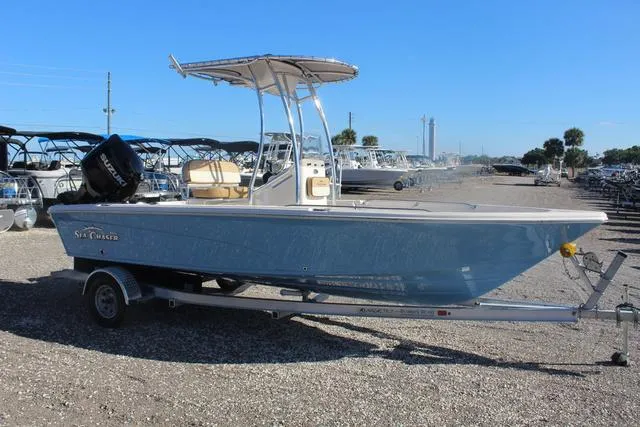 Slide: The Image of 2023 Sea Chaser 21 LX boat on a trailer in a marina. - 10