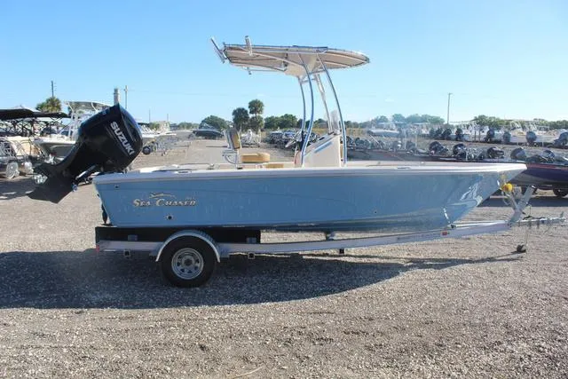 Slide: The Image of 2023 Sea Chaser 21 LX boat on a trailer with Suzuki outboard motor. - 12