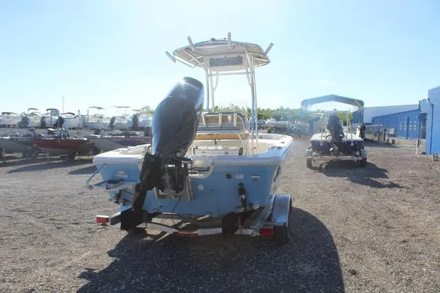 Slide: The Image of 2023 Sea Chaser 21 LX boat rear view with outboard motor on trailer. - 16