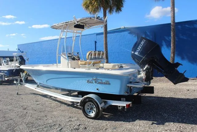 Slide: The Image of 2023 Sea Chaser 21 LX boat on trailer with Suzuki outboard motor. - 19