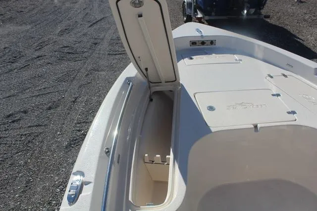 Slide: The Image of 2023 Sea Chaser 21 LX boat with open storage compartment. - 23