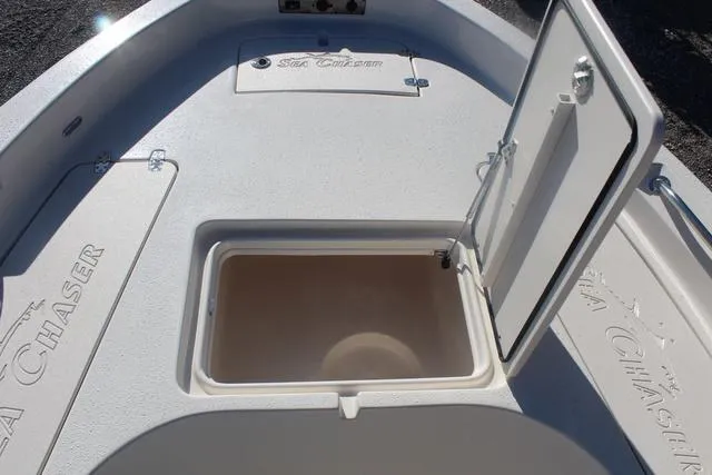 Slide: The Image of 2023 Sea Chaser 21 LX boat storage compartment with open hatch. - 24