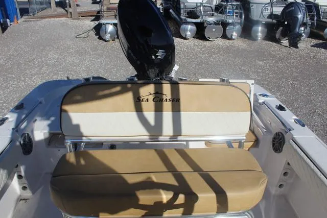 Slide: The Image of 2023 Sea Chaser 21 LX boat console with steering wheel and controls. - 28
