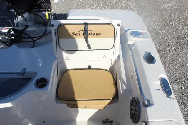 Slide: The Image of 2023 Sea Chaser 21 LX boat console with storage compartment and cup holders. - 31