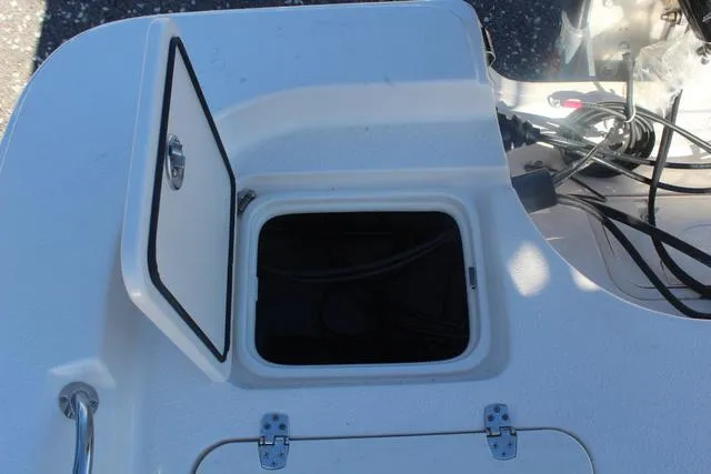 Slide: The Image of 2023 Sea Chaser 21 LX boat storage compartment with open hatch. - 35