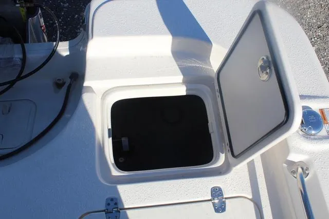 Slide: The Image of Open storage compartment on 2023 Sea Chaser 21 LX boat deck. - 36