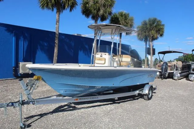 Slide: The Image of 2023 Sea Chaser 21 LX boat on a trailer, parked outdoors. - 5