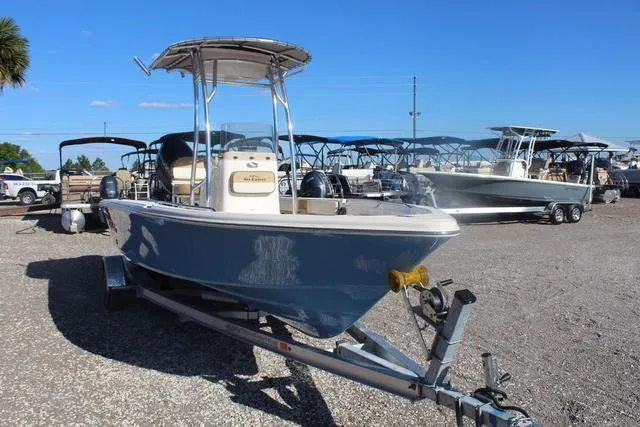 Slide: The Image of 2023 Sea Chaser 21 LX boat on a trailer in a marina. - 8