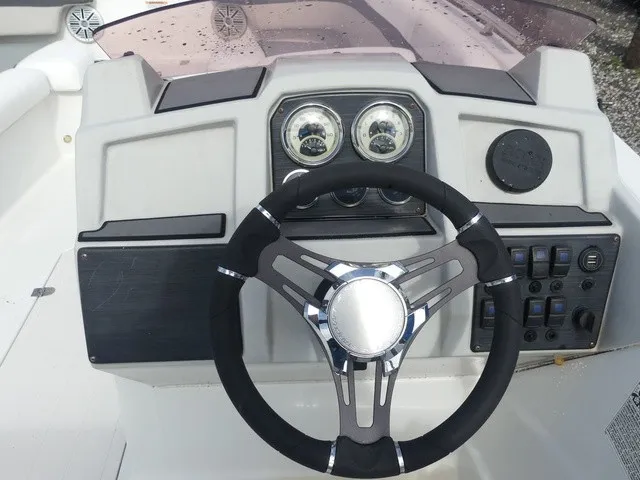 Slide: The Image of The image shows the helm of a 2021 Starcraft SVX 191 OB with modern instruments. - 22
