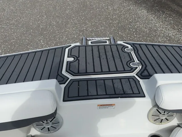 Slide: The Image of The image shows the stern of a 2021 Starcraft SVX 191 OB boat with black padding. - 16