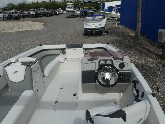 Slide: The Image of The image shows the cockpit of a 2021 Starcraft SVX 191 OB with modern controls and seating. - 13