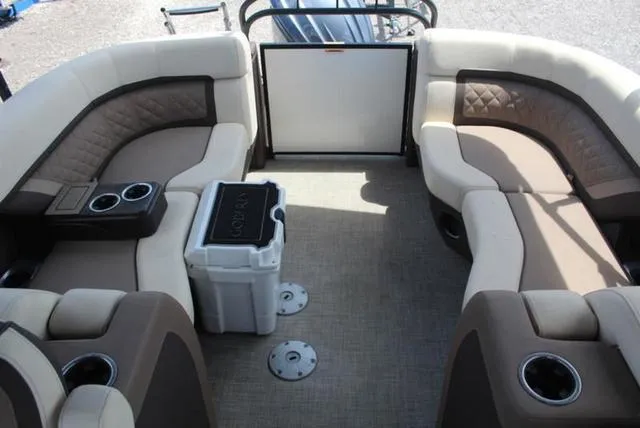 Slide: The Image of Shiny propeller of 2023 Godfrey AquaPatio 255 SBC boat on textured surface. - 10